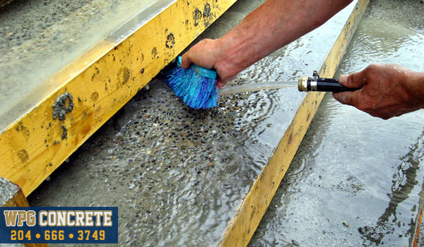 Washing exposed aggregate concrete in Winnipeg, Manitoba